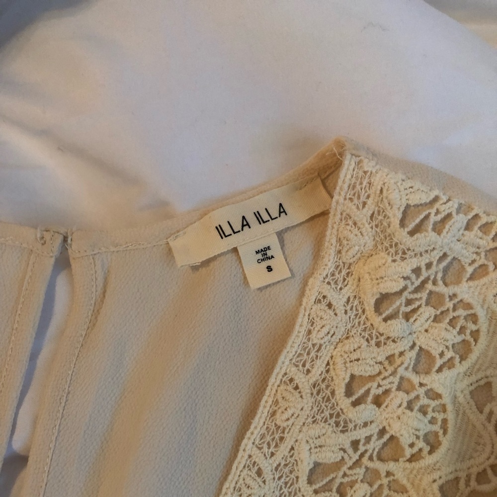 Cream romper with crochet details